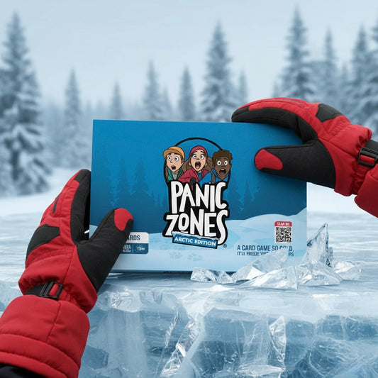Hands in red winter gloves holding Panic Zones Arctic Edition card game box against snowy forest backdrop with ice chunks